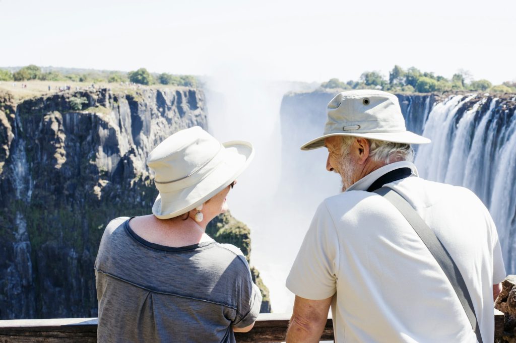 Couple looking out to Victoria Falls, Zambia