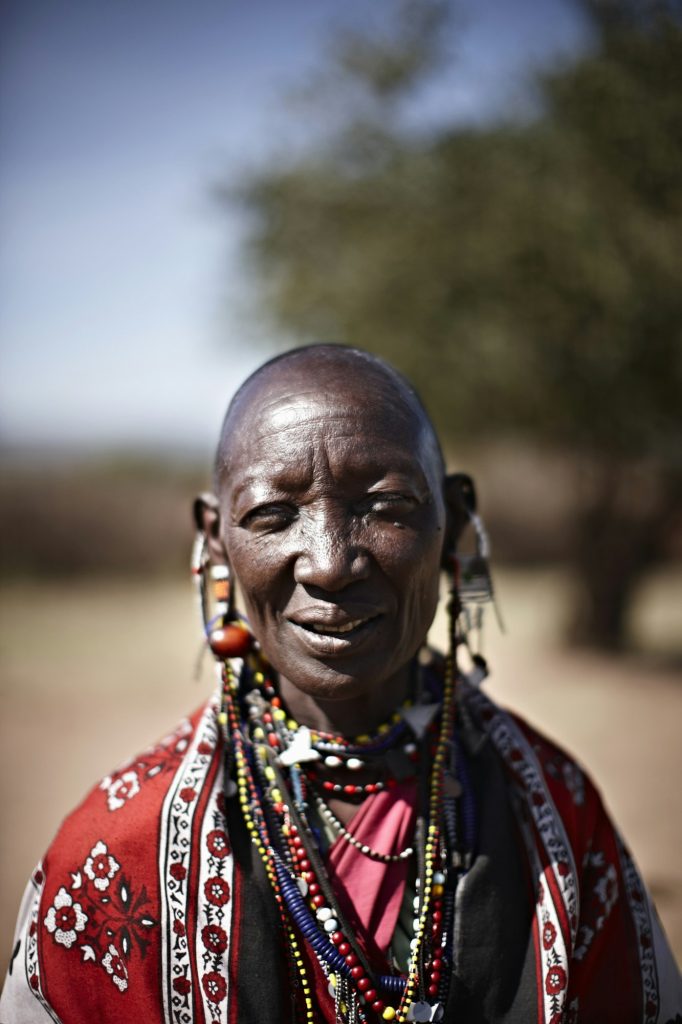 Smiling Maasai woman wearing jewelry